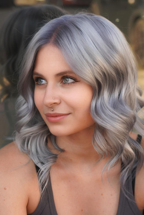 An elegant woman with gray hair colored by Manic Panic Dark Star and Blue Steel mix.
