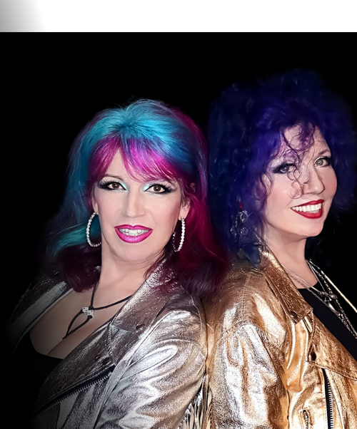 owners of Manic Panic, Tish and Snooky with vivid hair colored with Manic Panic, wearing silver and gold jackets