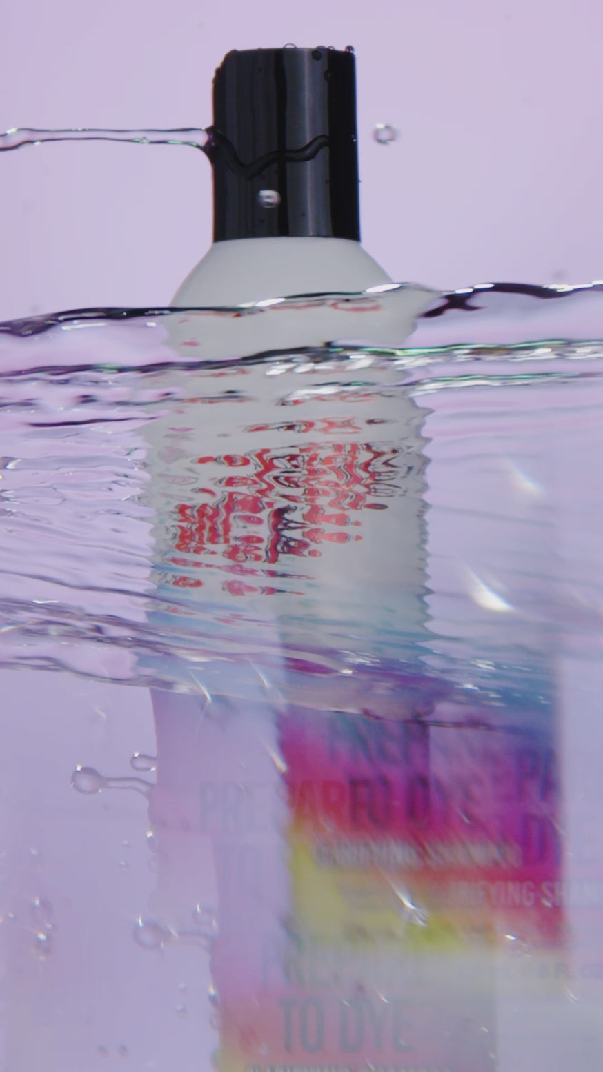 Water streaming over a bottle of Prepare to Dye Shampoo from the Manic Panic Hair Care line.