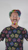 Manic Panic Ambassador Mykey O'Halloran with rainbow hair and beard wearing a Manic Panic Shirt
