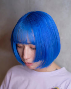 A woman with Blue Moon hair color by MANIC PANIC
