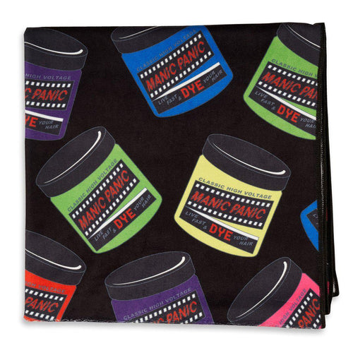 A vibrant Manic Panic beach towel with a black base and a multi-colored colored jar pattern.