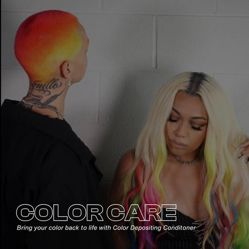 Two people with vibrant neon and rainbow hair, standing against a white brick wall. Text overlay: Color Care