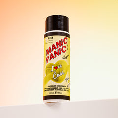 A bottle of Manic Panic® LOVE COLOR™ YELLOW HEART® conditioner. The packaging features red and blue graphics with text emphasizing the vegan formulation.