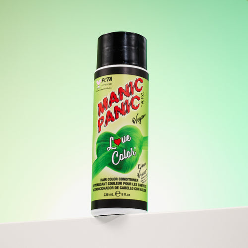 A bottle of Manic Panic® LOVE COLOR™ GREEN VENUS® conditioner. The packaging features red and blue graphics with text emphasizing the vegan formulation.