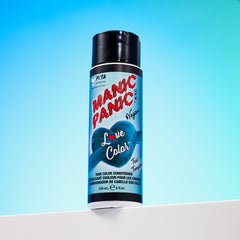A bottle of Manic Panic® LOVE COLOR™ TEAL TEMPTRESS® conditioner. The packaging features red and blue graphics with text emphasizing the vegan formulation.