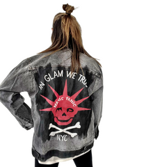 WOMAN WEARING A HAND PAINTED WREN AND GLORY DENIM JACKET WITH THE MANIC PANIC LOGO AND SKULLY LOGO