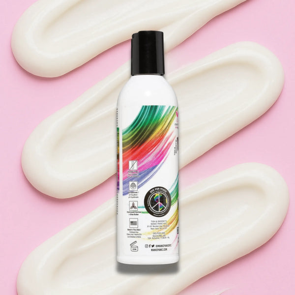 Bottle of hair product with colorful label on a pink background  of Keep Color Alive conditioner