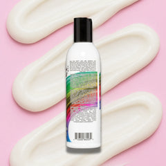 Keep Color Alive conditioner bottle with colorful label on a pink background