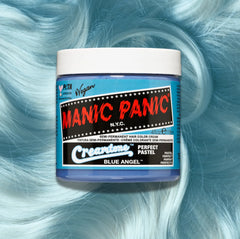 Manic Panic Classic High Voltage semi-permanent hair dye in shade Blue Angel a vibrant, vegan hair color. Image shows a jar of Blue Angel hair dye placed on top of a wavy pastel blue  hair swatch.
