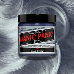 Manic Panic Classic High Voltage semi-permanent hair dye in shade Blue Steel a vibrant, vegan hair color. Image shows a jar of Blue Steel hair dye placed on top of a wavy  blue grey hair swatch.
