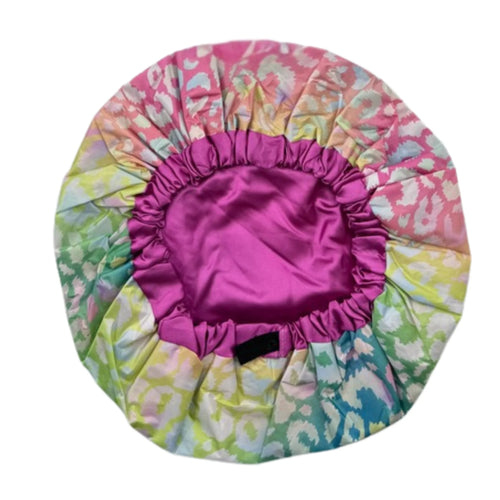 Inside view of Bright Pastel Leopard waterproof shower cap showing elastic band and satin lining