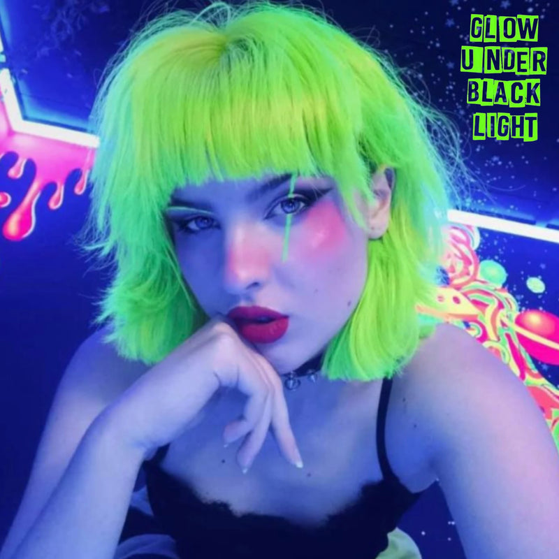 Short bob hairstyle with Electric Lizard neon green UV reactive hair glowing under blacklight