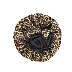 Leopard print bonnet with black interior on a white background