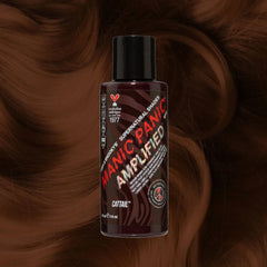 Manic Panic SuperNaturals Cattail brown hair dye bottle on warm brunette wavy background.