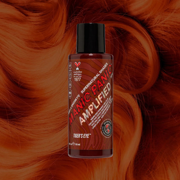 Manic Panic SuperNaturals Tiger’s Eye hair dye bottle on copper-brown wavy hair background