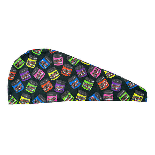 A vibrant Manic Panic hair turban with a black base and a multi-colored colored jar pattern.