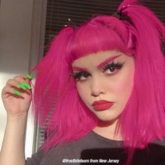 A woman with Hot Hot Pink hair color by MANIC PANIC